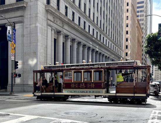 Full info at https://www.streetcar.org/cablecars/42-no-42-ofarrell-jones-hyde-streets-1910s-livery/ 

No. 42
O’Farrell, Jones & Hyde Streets (1910s livery)
Built 1906, W. L. Holman Company, San Francisco
This is one of two cable cars in Muni’s fleet representing historic lines that haven’t operated in decades. It was acquired and partly restored by Market Street Railway.

This is exactly how this cable car looked when ferry riders from Sausalito, crossing the bridgeless Golden Gate, streamed of…