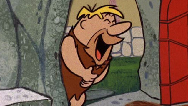 Barney Rubble from the Flintstones, in a doorway, laughing helplessly with his eyes closed