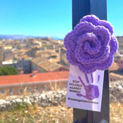 a purple knitted rose in korfu, greece. roses against violence