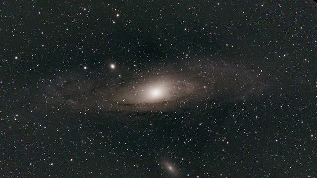 M31 The Andromeda Galaxy - unprocessed image. The Andromeda Galaxy is surrounded by a massive, nearly invisible halo of hot gas and at least 35 dwarf galaxies, including M32 and M110.