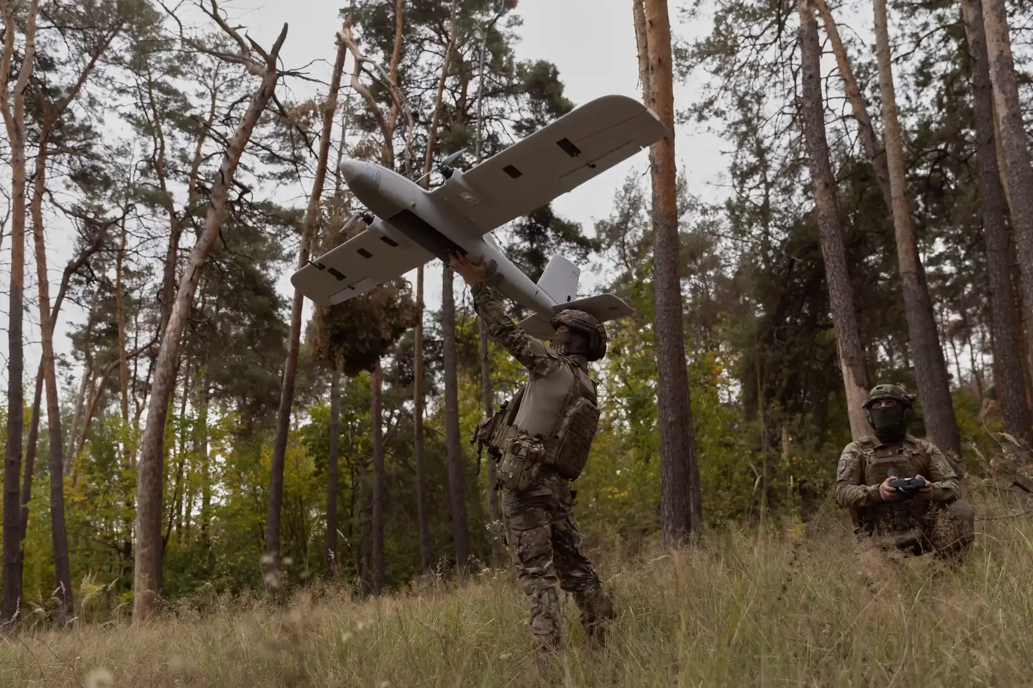 Ukrainian soldiers launch an Avenger drone.