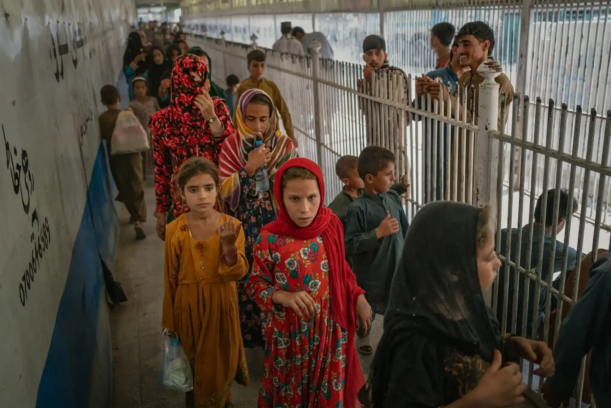 Afghan migrants at the border with Pakistan, from where they have been deported.