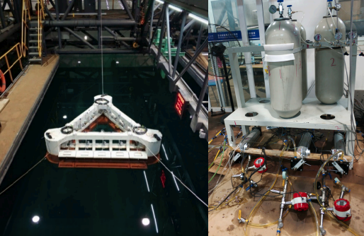 Image split 2/3-1/3 horizontally.

Left: white triangular device with a red bottom is suspended above a tank with three cables.

Right: three tanks stacked up on a stand with some red devices in front of them.