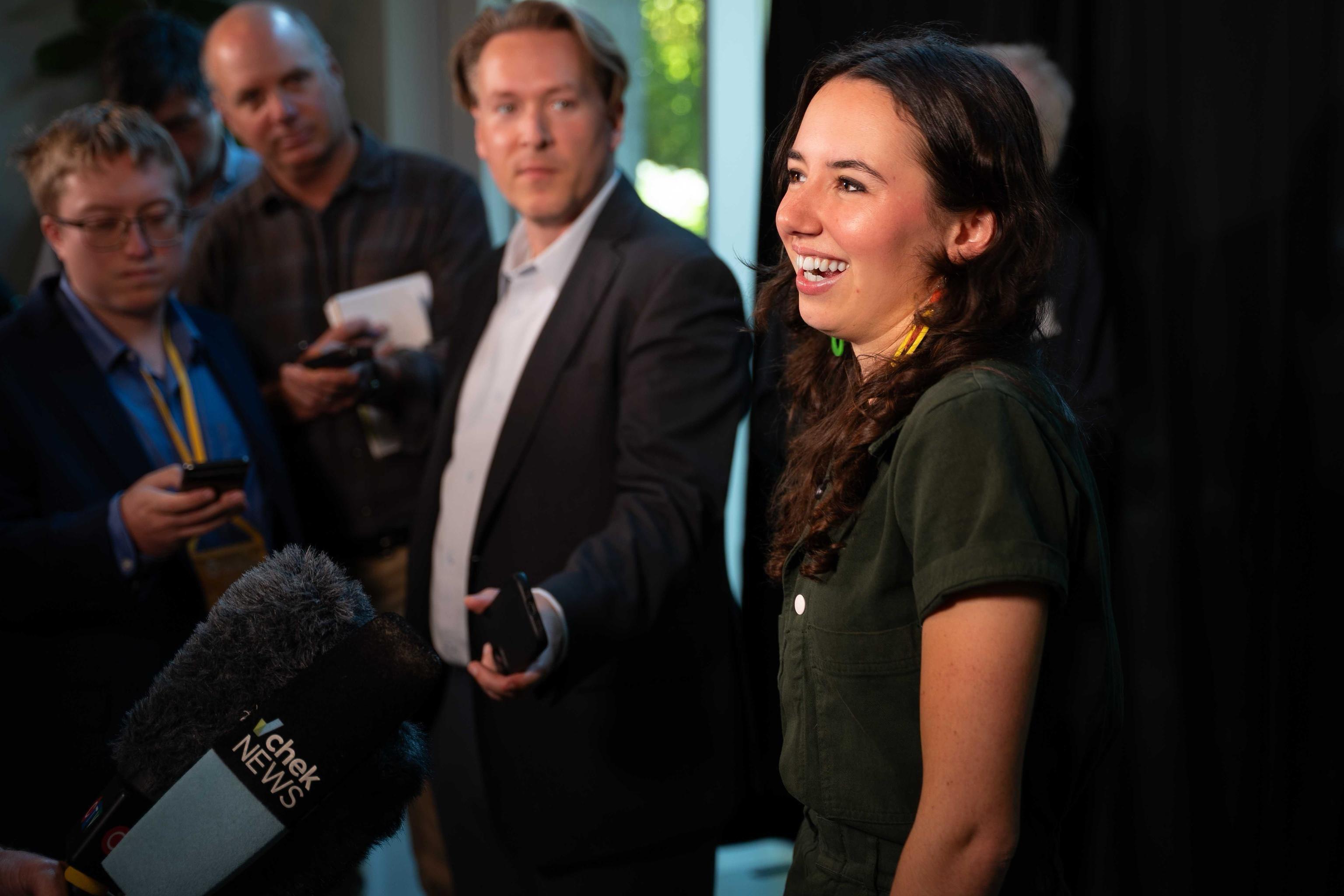 Emily Lowan being interviewed during a media scrum after winning the BC Greens Leadership race.