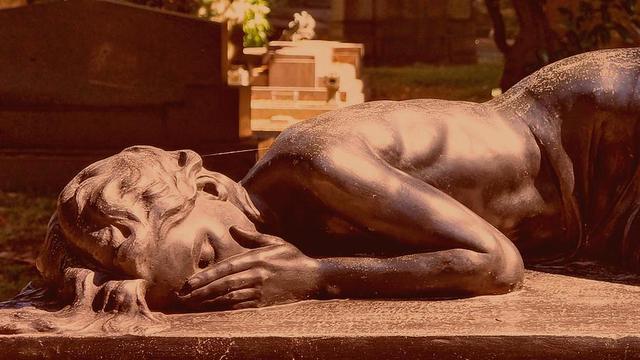 Statue of crying person.