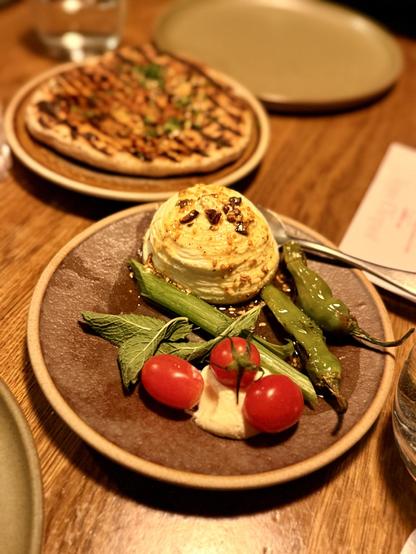 Whipped shenkleesh cheese with veggies and bread