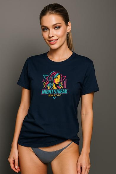 A young woman poses confidently in a navy blue t-shirt featuring a vibrant graphic design that reads "NIGHT STREAK" in bold, colorful letters. The shirt showcases a stylized illustration of a woman with flowing hair, embodying a fun and energetic vibe. She pairs the t-shirt with gray underwear, emphasizing a casual yet stylish look. The background is a simple gray, allowing the shirt's design to stand out. This image captures a modern, youthful aesthetic, perfect for those looking to express their personality through fashion.