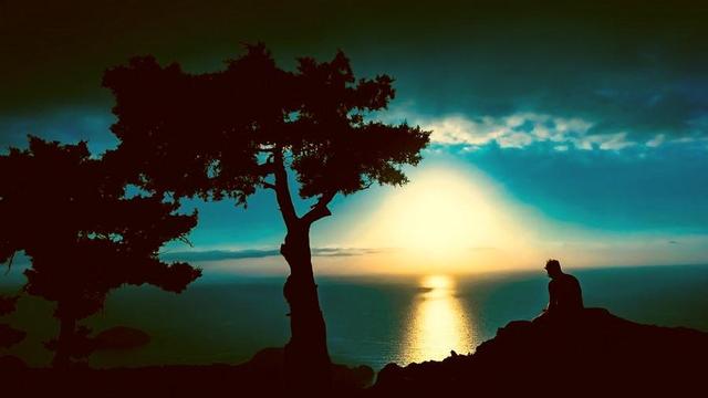 Person looking at sunrise.