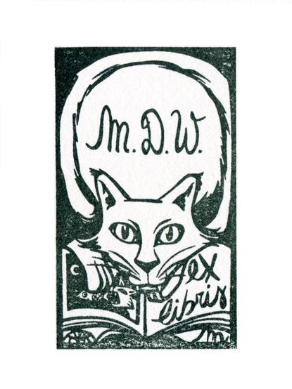 An image of the cat design in my ex libris stamp series. You see the design stamped on paper in black ink. It is a cat leaning on an open book. On the right page of the books are the words “ex libris”. Its tail is curling around the edge of the stamp, and in the open space between the cat's head and the tail are the initials “M.D.W.”