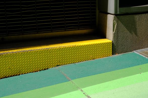 Yellow steel and green concrete 