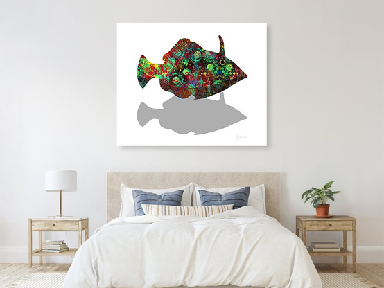 Wall mounted canvas print of Colourful Fish Leatherjacket Shadow Swimmer by Joan Stratton - paintingsbyjoan.com in a bedroom setting.

A bold little character! That horn-like projection, cosmic swirl of colour, and shadowed echo below give it a cheeky, almost defiant energy - like it’s darted out from a coral crevice just to be admired.

A leatherjacket fish zips through the white, its horn raised like a crown, its body stitched with cosmic colour and cheeky confidence. Swirls of red, green, yellow, and blue ripple across its form like a reef in motion, while its shadow swims quietly beneath, echoing its bold silhouette.

This isn’t just a fish, it’s a flash of personality. A creature with flair, rhythm, and a touch of mischief. It feels like summer saltwater and reef-side secrets, like something you glimpse once and never forget.

Created using my Ether Art technique — hand-drawn digitally from a blank canvas — this piece blends expressive abstraction with storytelling and vibrant rhythm.

Perfect for lovers of quirky marine art, surreal design, and joyful colour. Available across fine art prints, canvases, puzzles, apparel, and home décor.

Loaded without a background so you can choose your own colour on products :)

Explore more expressive aquatic and abstract works in my gallery at:
https://joan-stratton.pixels.com/collections/fish+
sea+dragons+and+horses