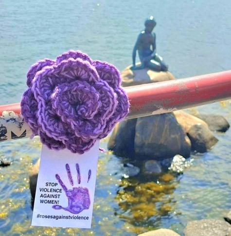 a crocheted purple rose in kopenhagen, denmark