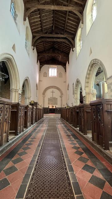 A picture of the interior of St Mary's, taken from the end of the aisle looking towards the altar.