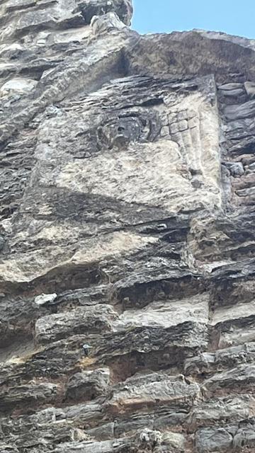 The Deerhurst Angel, placed high on a wall at the back of the church by the ruined Apse.