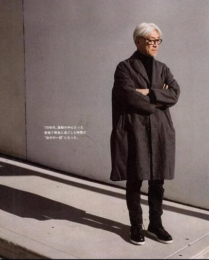 Photo of Ryuichi Sakamoto not looking stupid in a long coat