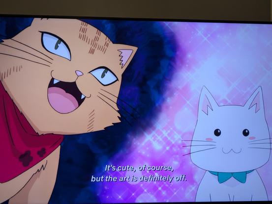 Anime screen shot. Two cats of different art styles are on screen. 

Subtitles read "it's cute, of course, but the art is definitely off." 