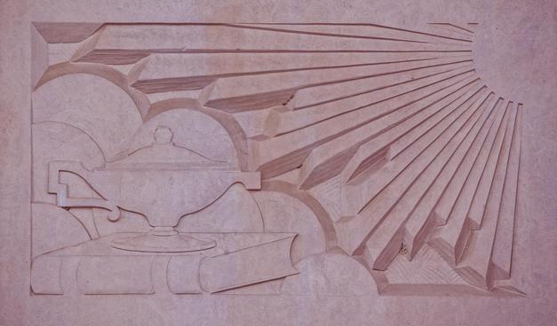 A little bit more of a quarter circle in the upper right corner represents the sun with rays of light represented as hewn stone with shadow between the ways and at the irregular ends,  to the lower left is a (I think) I cloud represented as four quasi-spherical lumps and a mieddle eastern oil lamp rests on top of a book fastened with straps.