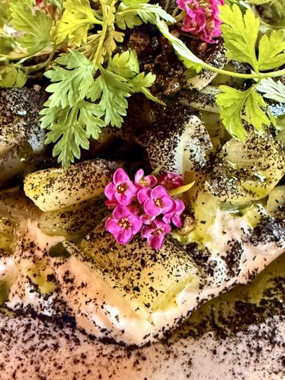 Close up on the presentation including of some lovely pink flowers. 