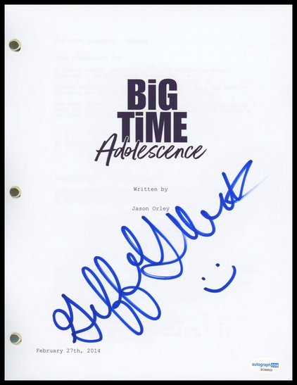Front cover of the script for the film Big Time Adolescence written by Jason Orley. Signed in cursive with a blue pen, plus a little smiley face, by Griffin Gluck who played Monroe.