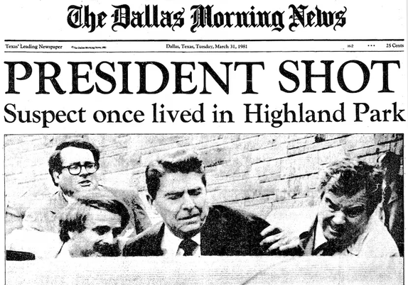Front page of the March 31, 1981 issue of The Dallas Morning News featuring the headline "PRESIDENT SHOT Suspect once lived in Highland Park" and a photo of President Ronald Reagan being hustled into the presidential limousine after having been shot by John Hinckley, Jr.
The Dallas Morning News
