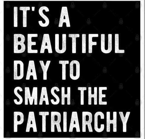 White writing on black background. Text reads "It's a beautiful day to smash the patriarchy".