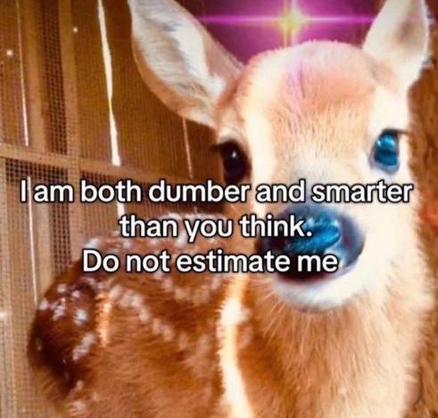  A close-up photograph of a fawn with large, dark eyes. The image has a warm, glowing, and sparkly filter. Black text is overlaid on the image, which reads, "I am both dumber and smarter than you think. Do not estimate me".