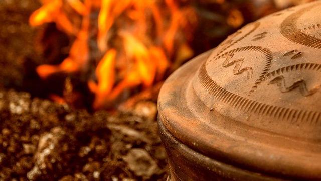 Clay pot on a fire.