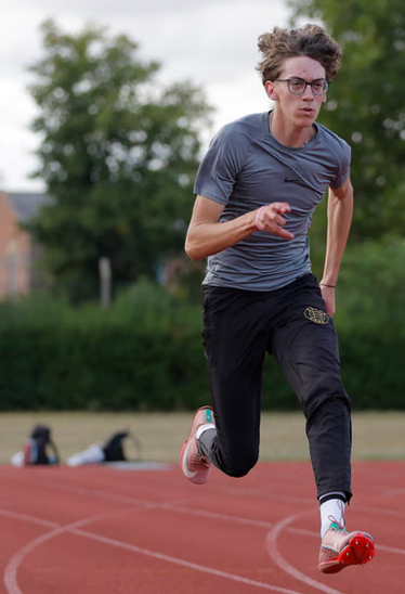 White kid is catching aire on a curved section of track