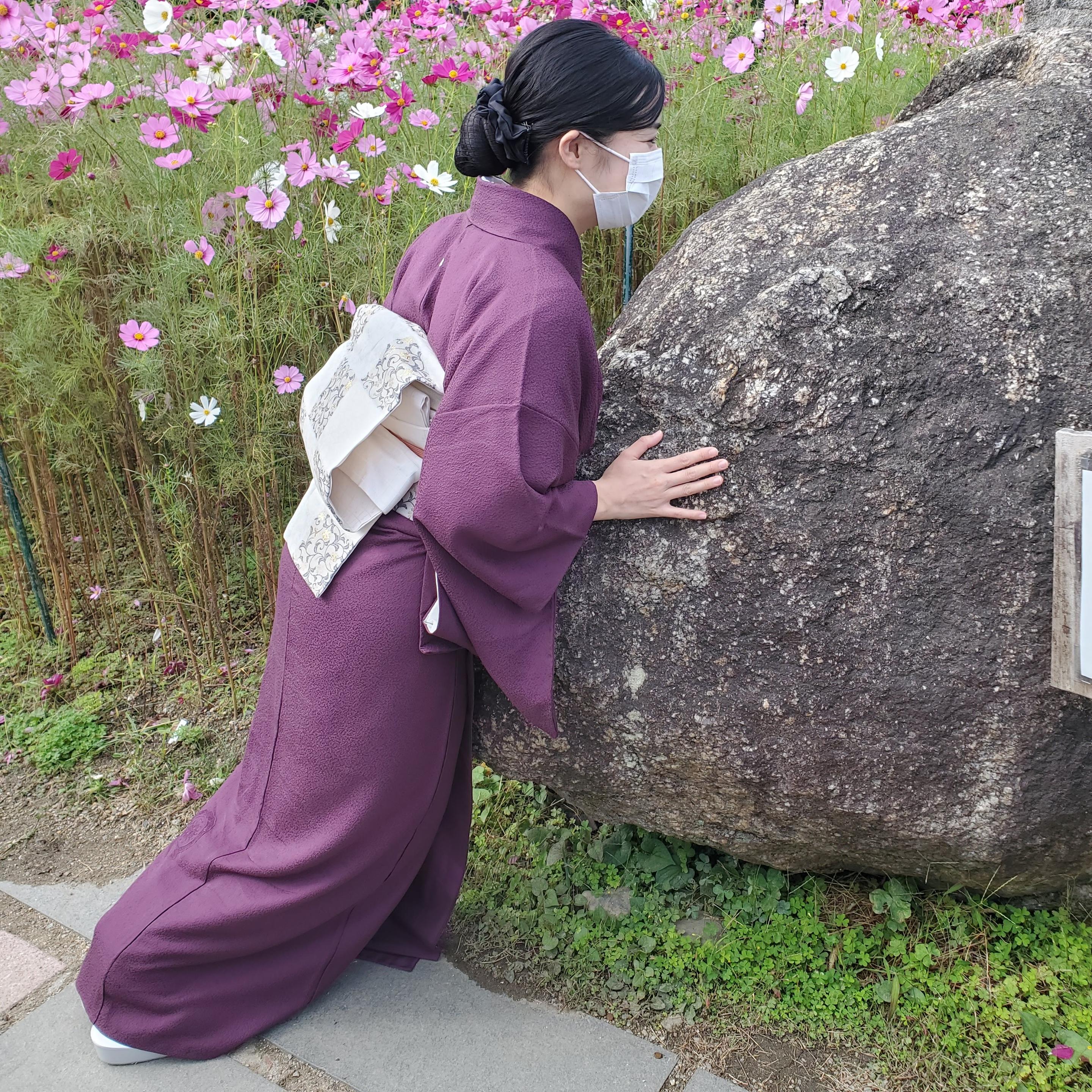 Visitors to Hannya-ji place their bellies and back against the 'Kanman-ishi'. It is said the rock grants good health.