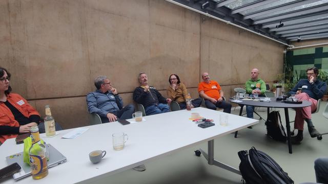 People discussing around a table 