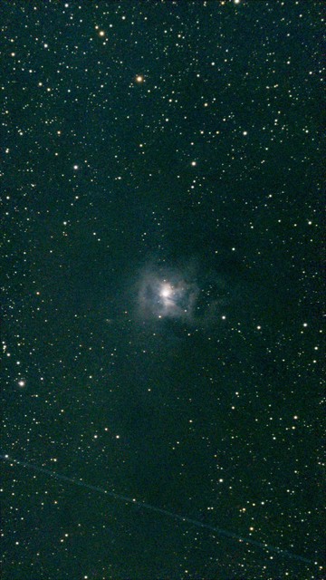 NGC 7023 The Iris Nebula - unprocessed image.  This beautiful reflection nebula glows blue as dust reflects the light of its central star. Its "petals" of cosmic dust make it resemble an iris flower. 