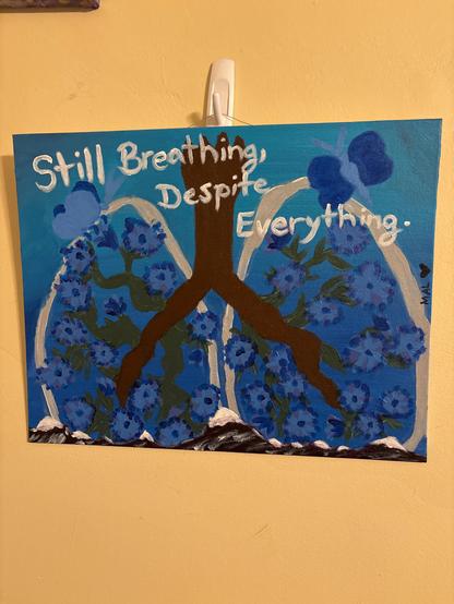 Painting of lungs with roots replacing the bloodstream / structure of lungs and stems of chicory flowers in the lungs. There are two butterflies. Text reads: Still breathing, despite everything. It is a phrase Tav uses in Baldur’s Gate 3