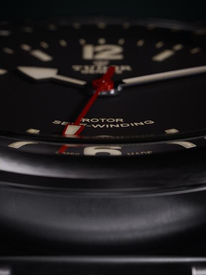 A photorealistic render of a Tudor Heritage Ranger watch. This is a closeup on the dial and we can see the refraction of the glass.