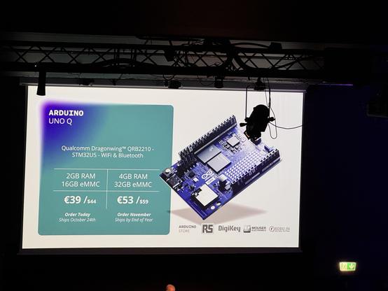 Image features a presentation slide for the Arduino UNO Q, showcasing its specifications and pricing. It includes details about the Qualcomm Dragonwing QRB2210, RAM options, storage capacity, and ordering information. A visual of the Arduino board is also displayed.