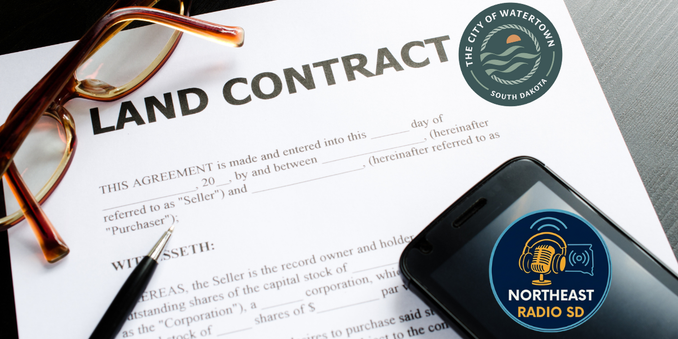 Land contract document with glasses and a pen on top. Phone displaying Northeast Radio SD and Watertown, South Dakota logos nearby.