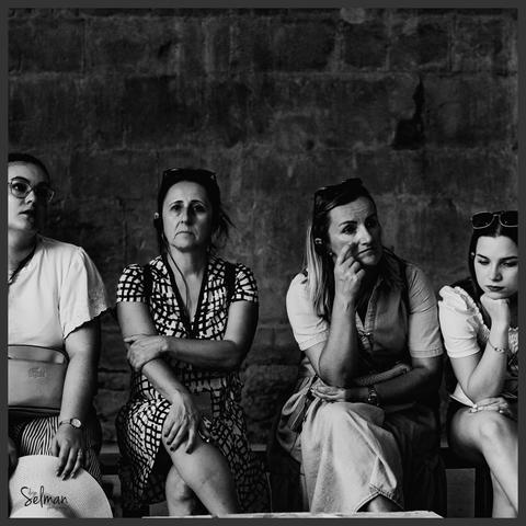 Capturing a life moment. Four ladies in their thoughts. Gordes, France. Black and white photography. Copyright by Silvijo Selman.