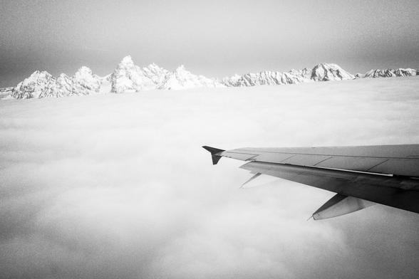 The Teton range, seen above the clouds from a plane departing Jackson Hole Airport.