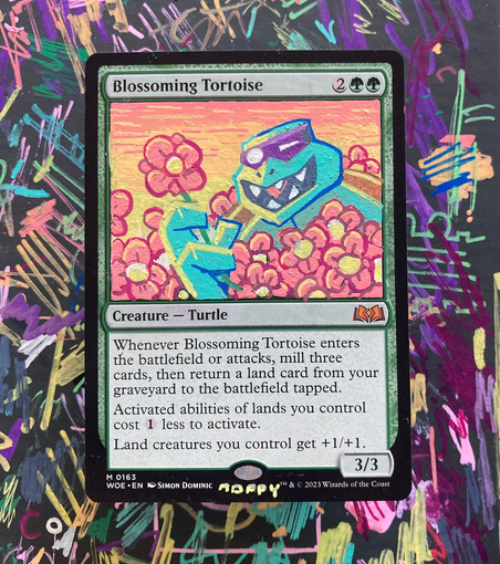 An alter of magic card Blossoming Turtle with depicted ninja turtle Slash amid a field of flowers. Holding up a plucked flower and gazing at it delightedly. 