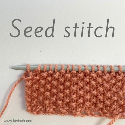 A swatch in salmon pink yarn on a gray knitting needle on which seed stitch is shown against a white background.