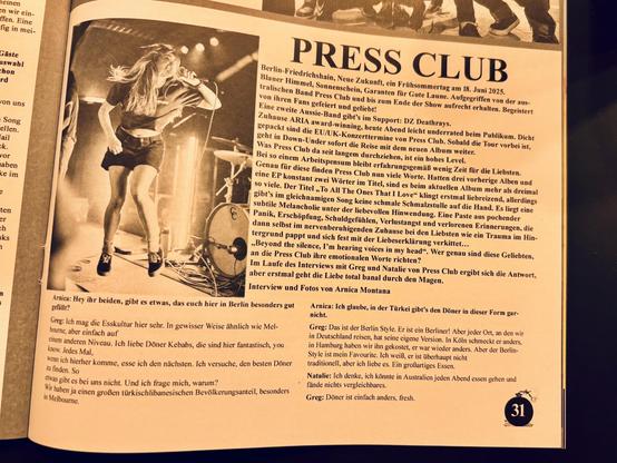 A black-and-white image features a female vocalist in mid-performance, energetically singing into a microphone on stage. The background shows drum equipment and stage lights. Accompanying text discusses a music interview related to the band Press Club, mentioning their popularity.