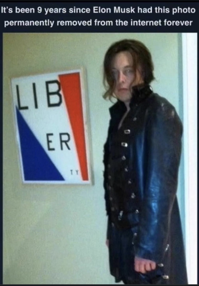 Greasy longish hair Elon Musk pictured in long leatherish mall  goth trech coat that the richest man in the world has tried to scrub from what's left of our once beautiful 'Net