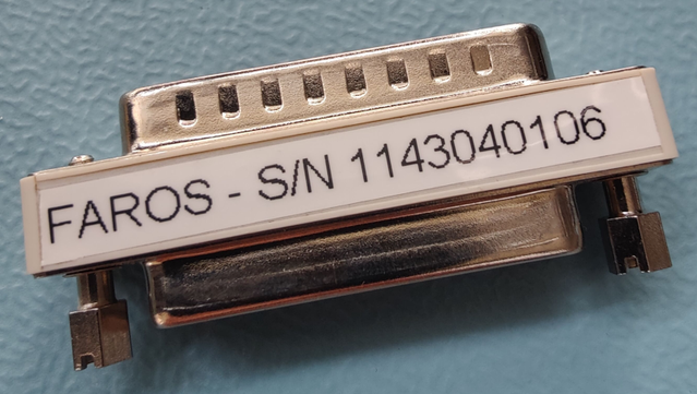 Parallel port security key for MD80 FMST. Labelled as FAROS with S/N 1143040106
