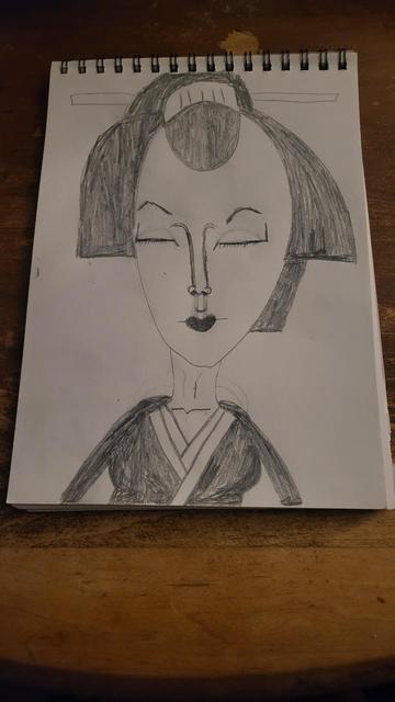 Geisha woman with her eyes closed and smiling