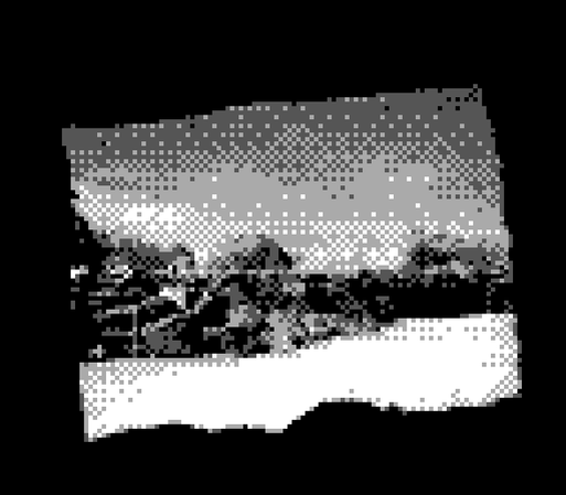 Photo de game boy camera. Un mur noir sur avec une ouverture rectangulaire au milieu, comme une fenêtre, mais un peu de biais, et avec des contours rugueux. C'est trop net pour être naturel, mais pas assez pour être industriel. Bizarre. Par cette ouverture on peut voir un paysage, une plage, avec des digues de rocher, et le ciel par dessus.