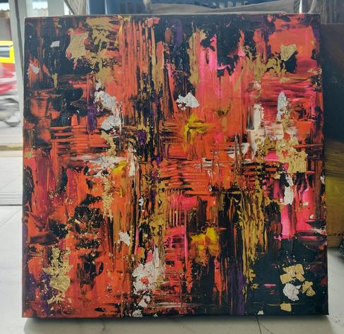 an abstract painting, it is red-orange and gold and black and white paint, the colors meeting each other with fractured comb-like edges 