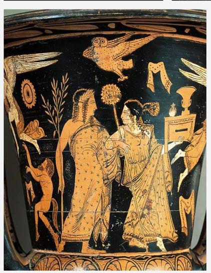 Red-figure vase painting of Dionysos and his wife Ariadne, both dressed in long, patterned robes. He holds an olive or laurel branch while she holds a thyrsos staff and a box. Above them flies an owl.