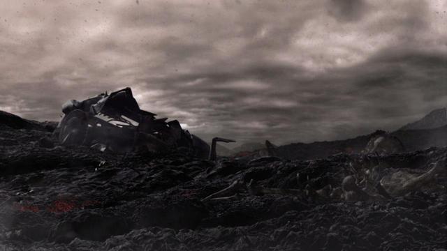 Un cielo cupo incombe su un paesaggio arido e roccioso. Si intravedono i resti di una grande macchina di origini sconosciute ridotta a pezzi e parzialmente sepolta nel terreno.