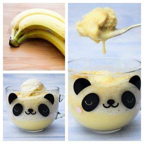 Bananas and banana custard sponge pudding in a panda mug topped with a dollop of vanilla ice cream.