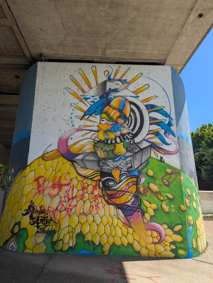 Colorful mural under a bridge in Arle