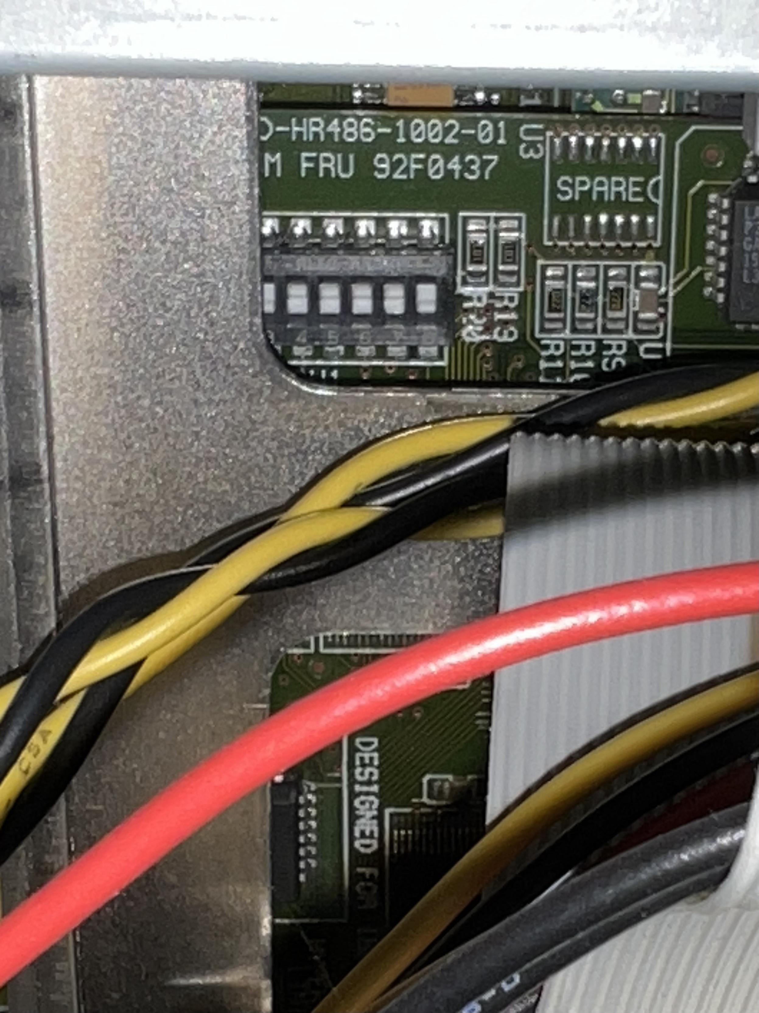 A portion of a green circuit board with silk screen in white that reads “FRU 92F0437”